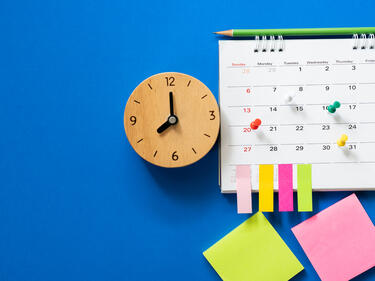 calendar and clock on blue background